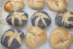 Hand made Kaiser rolls, partially with poppy seeds
