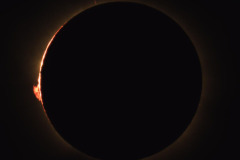 The last light of the sun before the moon completely covers the sun, showing Baileys Beads